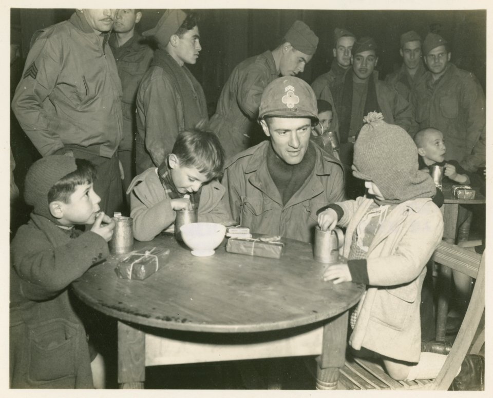 Three Children are watched over by Sgt. Thomas Lilly, Phil…