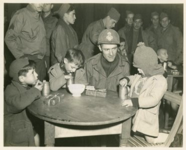 Three Children are watched over by Sgt. Thomas Lilly, Phil…