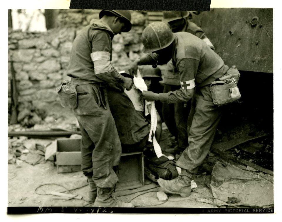 American infantryman gets back wound bandaged by medics af…
