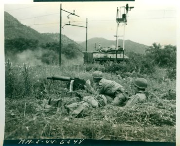 An American M-10 tank destroyer has just fired into the Ga… photo