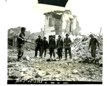 Covered by an American guard these German prisoners are sh… photo