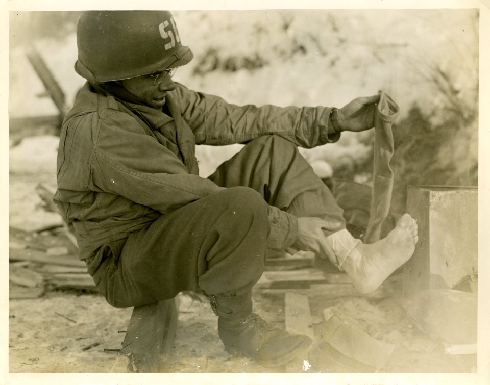 Pvt. Guy V. Silvis, of Elderton, Pa., drying socks and che…