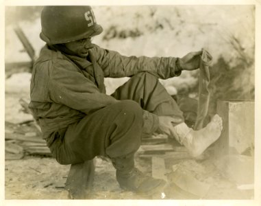 Pvt. Guy V. Silvis, of Elderton, Pa., drying socks and che…