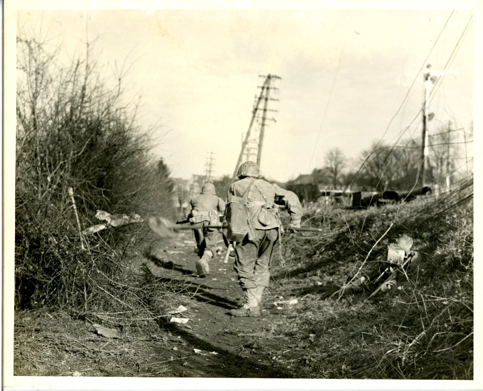 Infantrymen fight along railroad bank during assault on to…