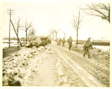GIs of the 2nd Infantry Division moving along a road in Mo… photo