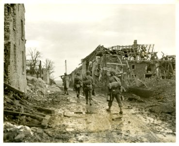 Infantrymen of the 104th Division moving into Lucherberg, … photo