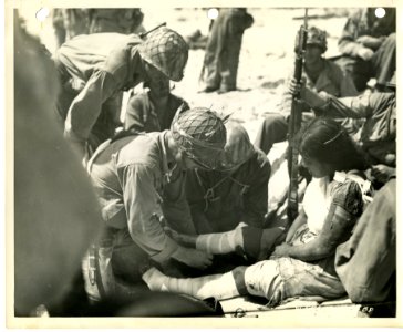 A native woman is given medical attention by 7th Div. medi… photo