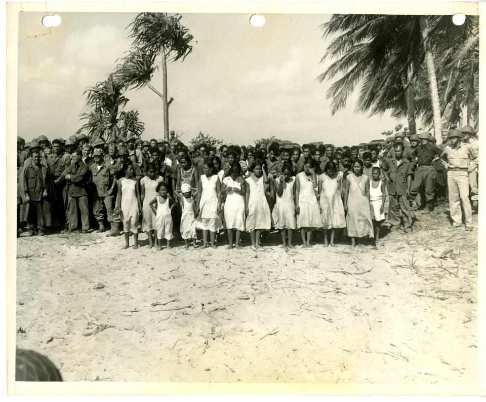 American soldiers with natives on Kwajalein, 1944
