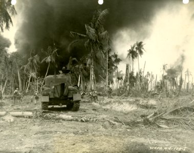 Infantrymen advance aided by medium tank on Kwajalein. 1 F… photo