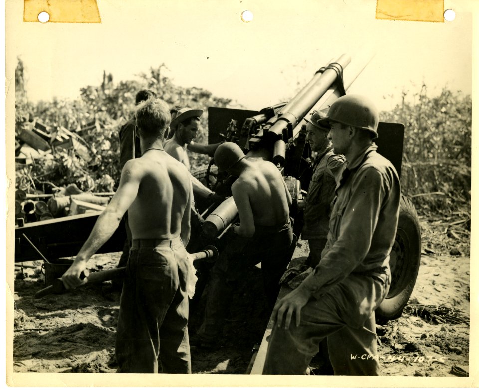 Gun crew of 105 Howitzer in action on Carlson Island, Kwaj…