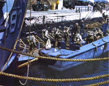 American troops at a British port descend into barges whic… photo