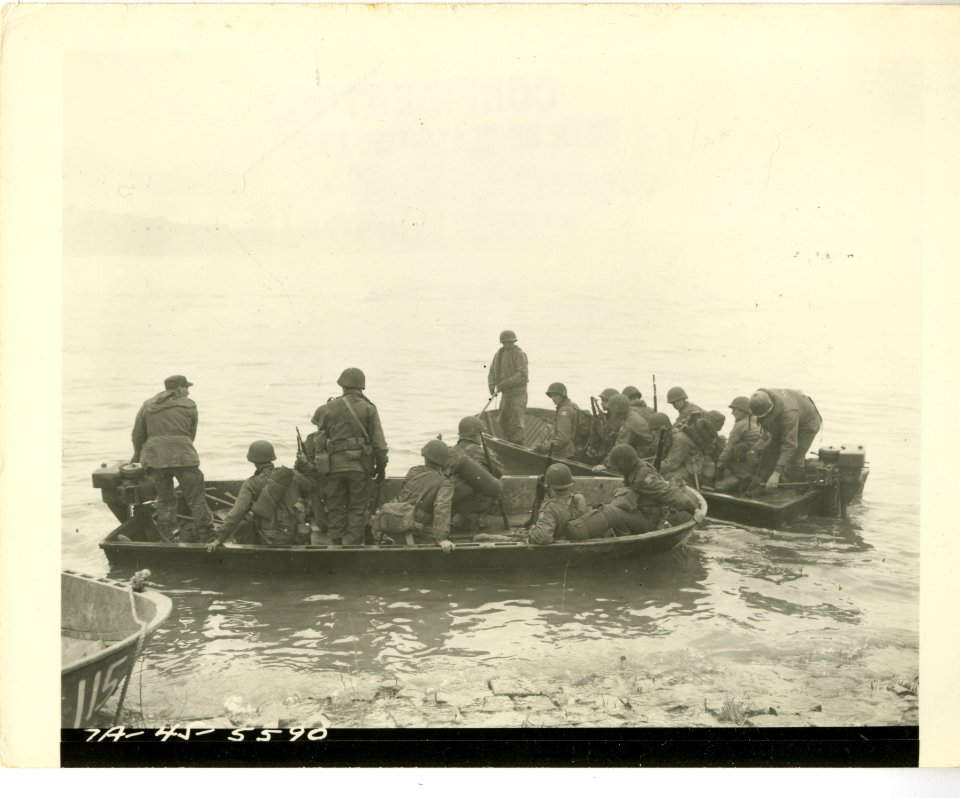Two assault boats filled with infantrymen of the 7th Infan…