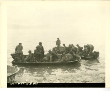 Two assault boats filled with infantrymen of the 7th Infan… photo