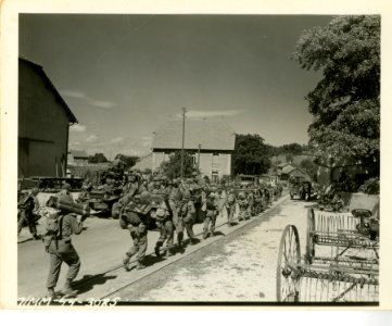 Infantrymen of the 3rd Division moving through unidentifie…