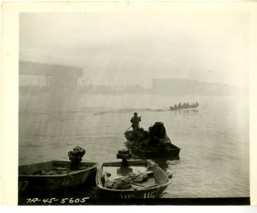 Assault boats loaded with Seventh Army infantry cross Rhin… photo