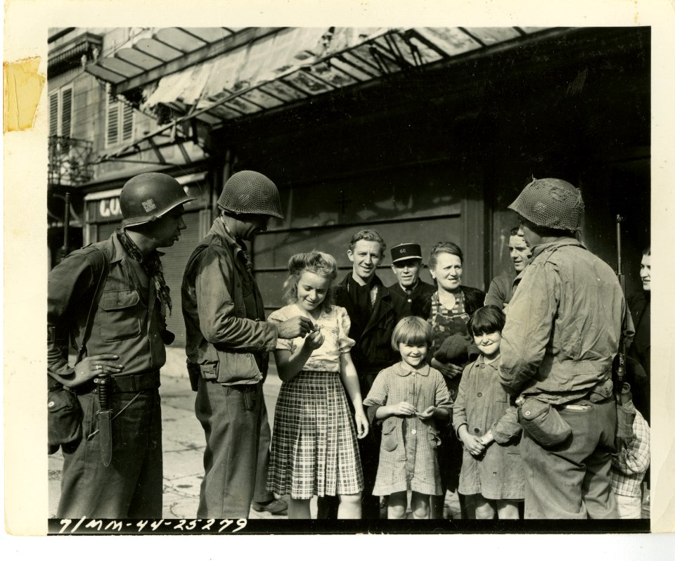 Shortly after the liberation of Lure, civilians crowd arou…