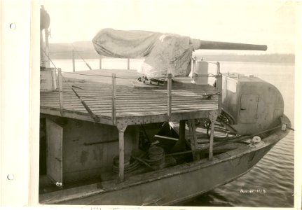 Gun at stern of boat being equipped photo