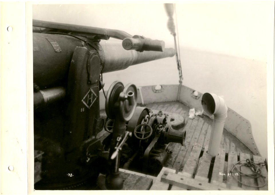 View of gun on bow of ship