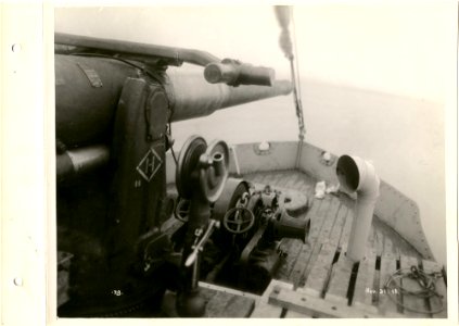 View of gun on bow of ship photo