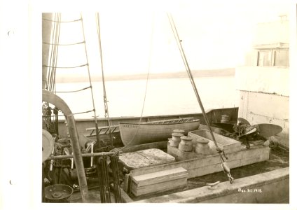 View of deck of boat being equipped, note lifeboat and pro…