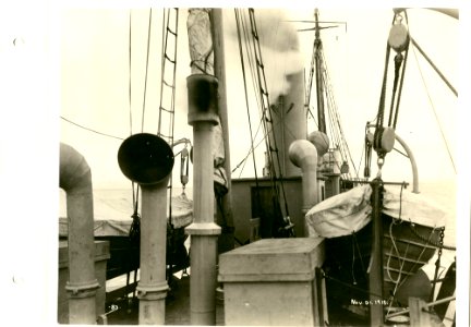 View of lifeboat and various stacks on aft deck of boat be… photo