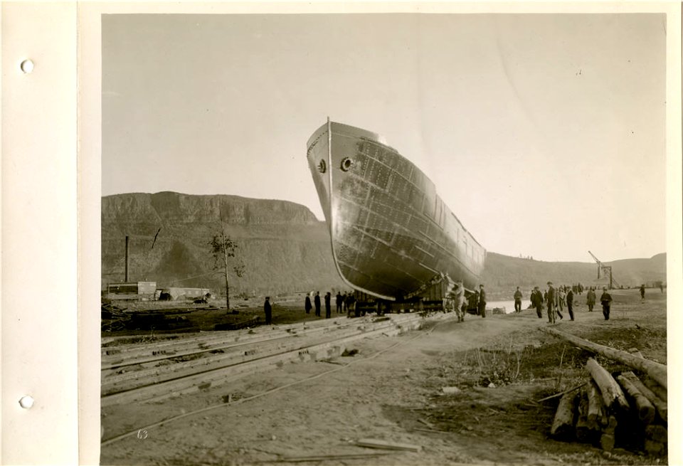 Ship on launching trucks ready to go down slip into water