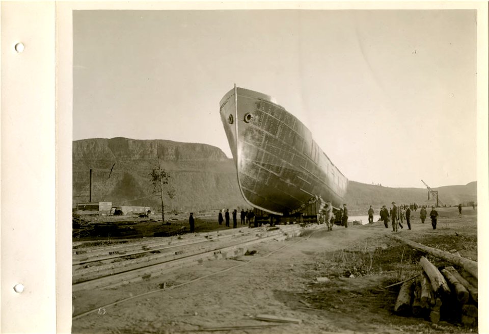 Ship on launching trucks ready to go down slip into water photo