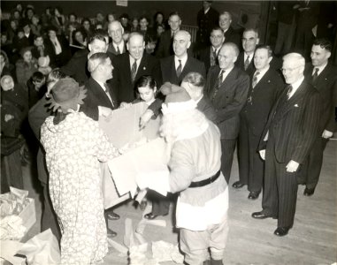 Port Arthur Mayor Charles Winnans Cox opens a present from…