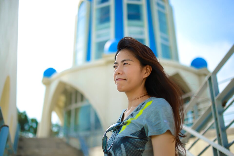 Travel asian woman wind blowing