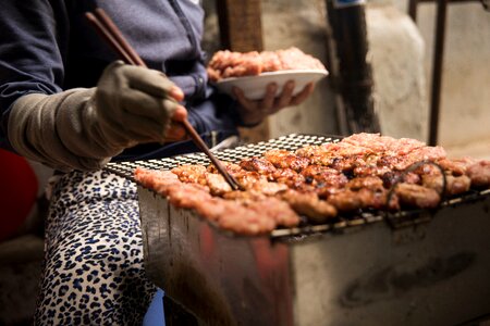 Woman grill pork
