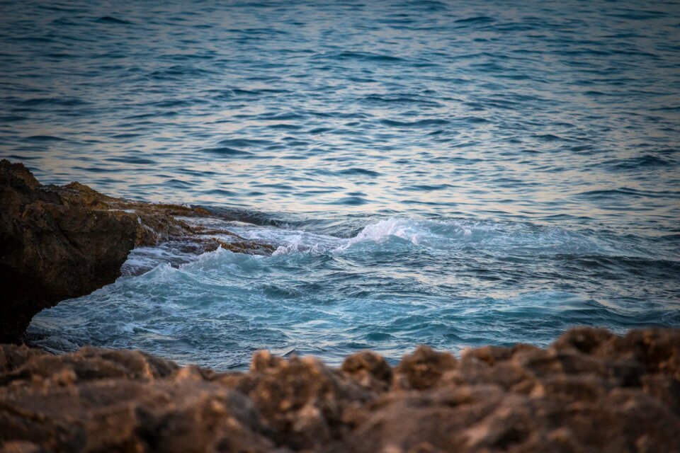 Rocks surf blue sea photo