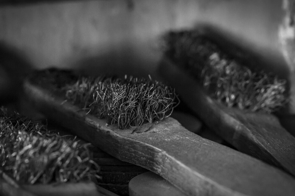 Decrepit steel brushes black and white gray tools photo