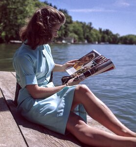 Female reading magazine photo