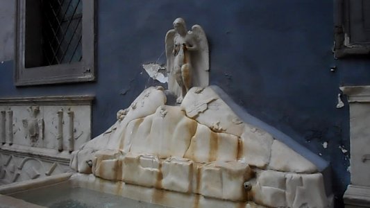 The Parthenope Siren with viola on Vesuvius and Spain coat-of-arms - The Spinacorona fountain (16th century) in Naples (31638291822)