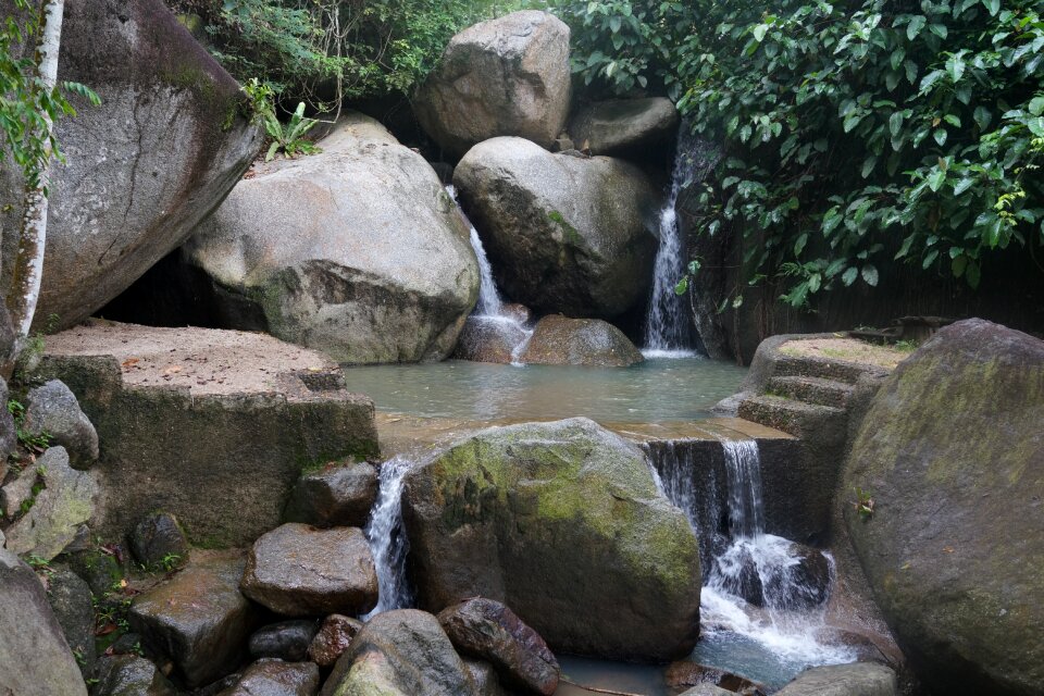 Clear water large boulders rocks