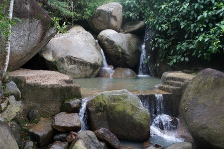 Clear water large boulders rocks