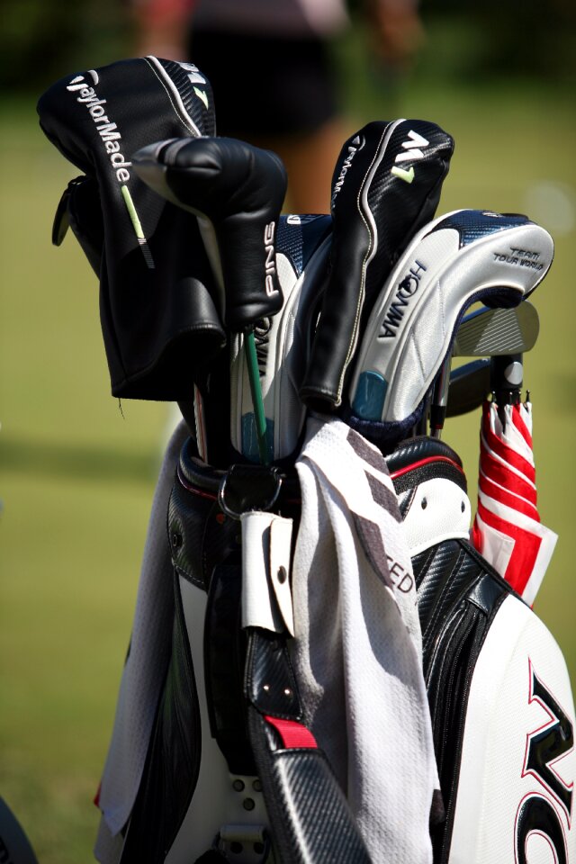 Golf course golf players golf bags