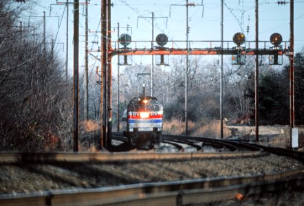AMTK 974 E60CH at MP 82 on the Amtrak Baltimore Division, about 2 miles south of Gunpow in December 1980 (33537571720) photo