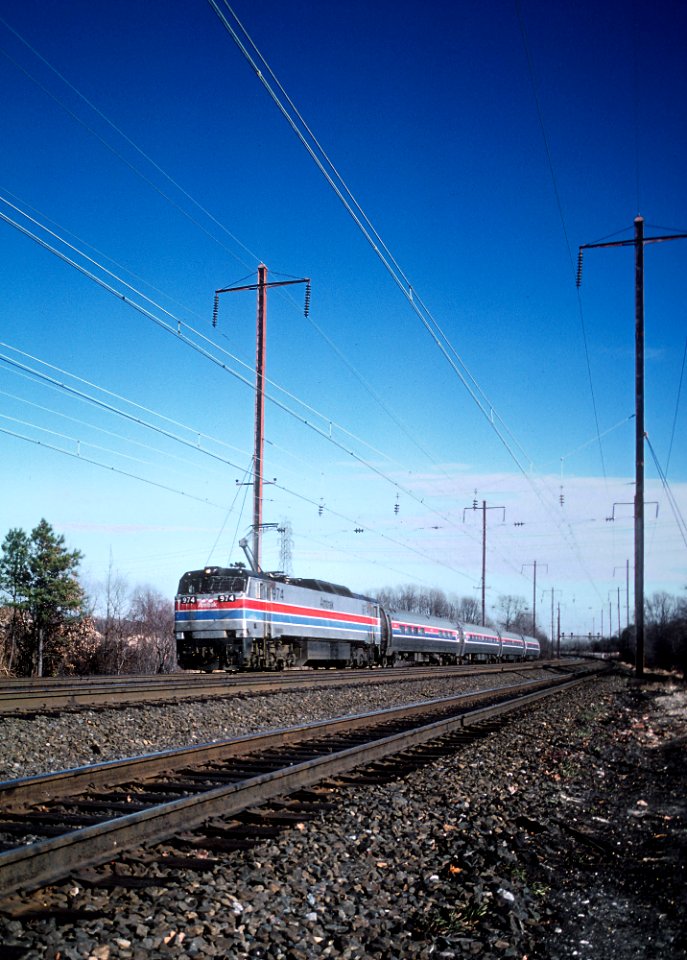 AMTK 974 E60CH at MP 82 on the Amtrak Baltimore Division, about 2 miles south of Gunpow in December 1980 (33537576480)