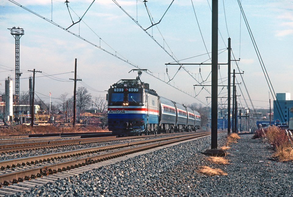 Amtrak AEM7 903 passing through Ivy City in Washington, DC in December 1980 (33857238141)