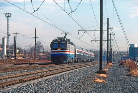Amtrak AEM7 903 passing through Ivy City in Washington, DC in December 1980 (33857238141)