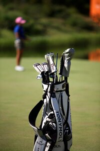 Golf course golf players golf bags