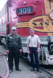 AT&SF firemen Norman Redd on right and M. T. Fordyec both of Raton, NM in front of 309L after they handled Train 23, the Grand Canyon, Colorado Division, Third District, Las Vegas, NM on August 19, 1967 (31217349110) photo