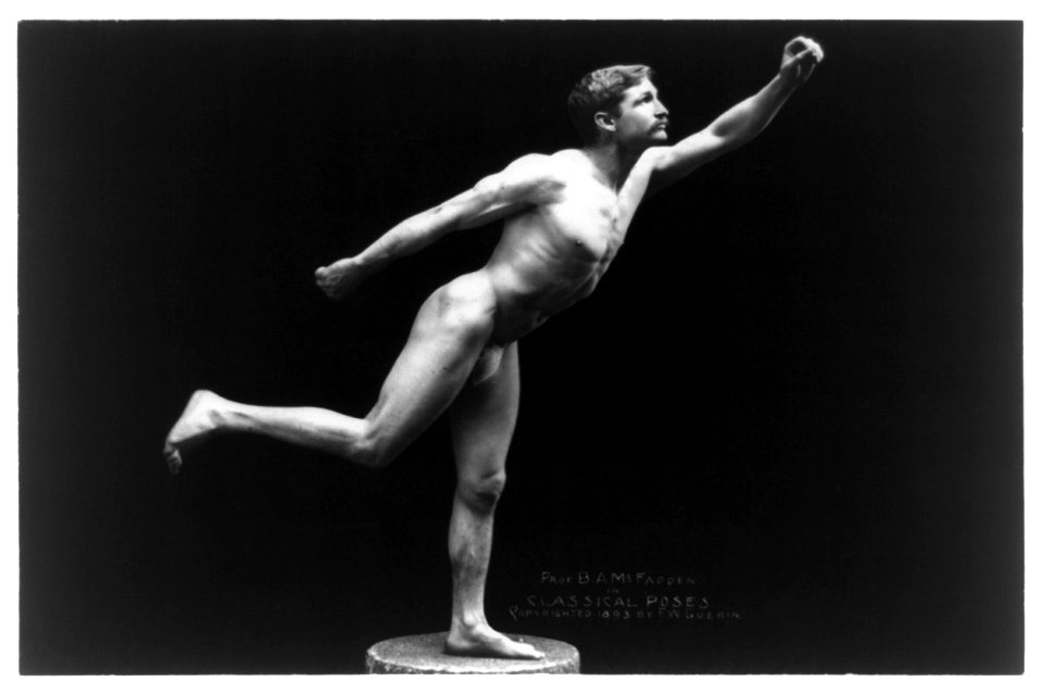 Nude male, Prof. B.A. McFadden, full-length portrait, standing on one foot on pedestal, facing right, wearing a fig leaf LCCN97510672