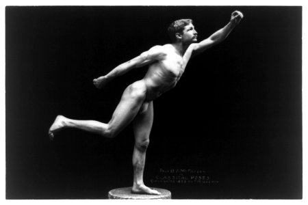 Nude male, Prof. B.A. McFadden, full-length portrait, standing on one foot on pedestal, facing right, wearing a fig leaf LCCN97510672