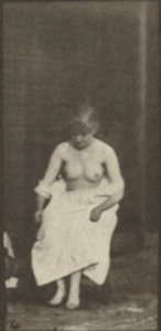 Nude woman sitting and disrobing (rbm-QP301M8-1887-498b~4)