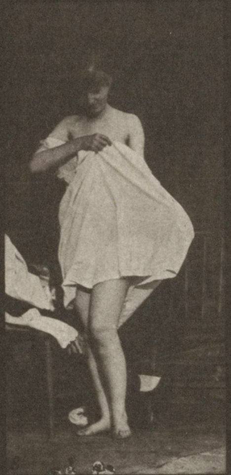 Nude woman sitting and disrobing (rbm-QP301M8-1887-498b~8)