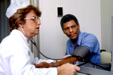 Nurse checks blood pressure