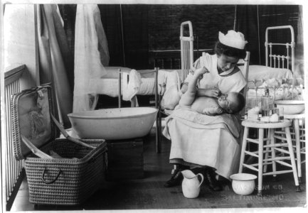 Nurse bathing baby LCCN2006675700