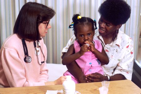 Nurse talks with mother